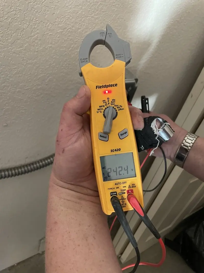 Voltage testing with clamp meter during Generator Installation in Olympia Heights